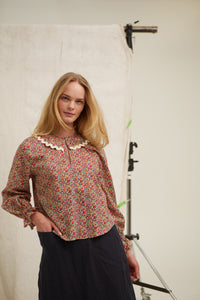Floral Liberty tana lawn blouse. Top. Frill detail on elasticised sleeve. Over the head blouse, Ruffled collar. Ric-rac trim. Curved hem. Cut long. 100% cotton