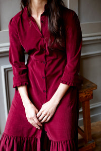 Deep red corduroy shirt dress, long sleeve, button down front, deep frill at hem
