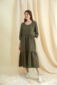 Linen tired dress. Three-quater sleeve, round neck, pull over head, midi length. Made in England